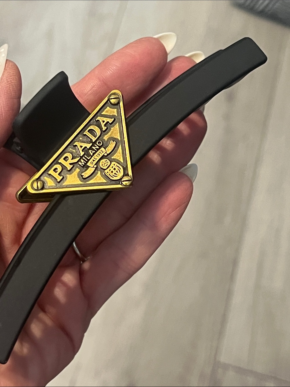 Black Hair Clip with Gold Triangular Logo